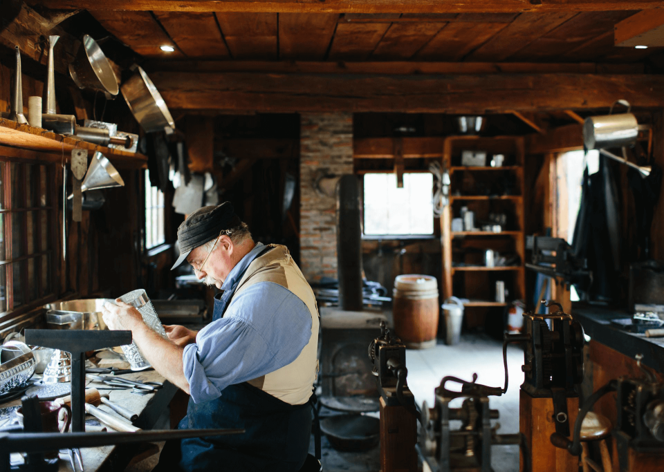 Tinsmith working by a window